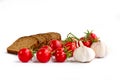 Composition of black bread slices, bunch of cherry tomatoes, gar Royalty Free Stock Photo