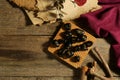 Composition with black rune stones on wooden table, flat lay. Space for text