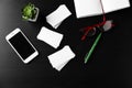 Composition with blank business cards, mobile phone, eyeglasses and pen on dark table