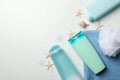 Composition with blank cosmetic bottles and starfishes on background Royalty Free Stock Photo