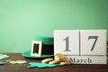 Composition with block calendar on table, space for text. St. Patrick`s Day celebration Royalty Free Stock Photo