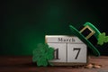 Composition with block calendar on table, space for text. St. Patrick`s Day celebration Royalty Free Stock Photo