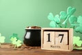 Composition with block calendar on table, space for text. St. Patrick`s Day celebration Royalty Free Stock Photo