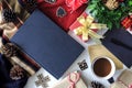 Composition of book with cup of coffee and Christmas decorations on table Royalty Free Stock Photo