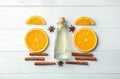 Composition with bottle of citrus essential oil on wooden table Royalty Free Stock Photo