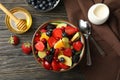 Composition with bowl of fresh fruit salad on background, top view Royalty Free Stock Photo