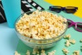 Composition with bowl popcorn on multicolor background
