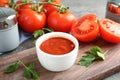 Composition with bowl of tomato sauce and parsley Royalty Free Stock Photo