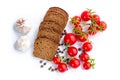 Composition of bread slices, bunch of cherry tomatoes and garlic Royalty Free Stock Photo