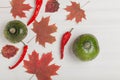 Composition of bright autumn leaves and vegetables on a light background Royalty Free Stock Photo