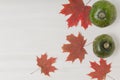 Composition of bright autumn leaves and vegetables on a light background Royalty Free Stock Photo