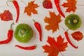 Composition of bright autumn leaves and vegetables on a light background. Toned Royalty Free Stock Photo