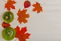 Composition of bright autumn leaves and vegetables on a light background. Toned Royalty Free Stock Photo