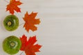 Composition of bright autumn leaves and vegetables on a light background. Toned Royalty Free Stock Photo