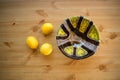 Composition of bright ceramic bowl and yellow lemons. Royalty Free Stock Photo