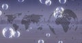 Composition of bubbles and world map with globe over cityscape Royalty Free Stock Photo