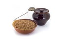 The composition of the Buckwheat groats in a clay pial next to a clay pot and a copper spoon, Royalty Free Stock Photo