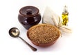 The composition of the Buckwheat groats in a clay pial next to a clay pot and a copper spoon, Royalty Free Stock Photo