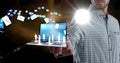 Composition of businessman using interactive screen with laptop, cloud and digital icons