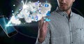 Composition of businessman using interactive screen with smartphone, cloud and digital icons