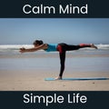 Composition of calm mind simple life text over caucasian woman practicing yoga on beach