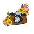 The composition of the camera and a bouquet of tulips and daffodils Royalty Free Stock Photo