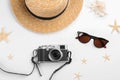 Composition with camera for photographer and beach objects on white background, top view Royalty Free Stock Photo