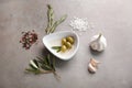 Composition with canned olives on grey table