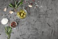 Composition with canned olives on textured table