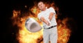 Composition of caucasian male golf player holding golf club over flames on black background Royalty Free Stock Photo