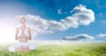 Composition of caucasian woman meditating with eyes closed with copy space over clouds and blue sky Royalty Free Stock Photo