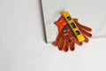 Composition with ceramic tiles and gloves on white background