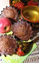 Composition chocolate cupcakes in metal forms, on the background of decorative spoons Khokhloma, fragrant homemade cakes