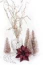 The Composition of christmas decorations with brocade twigs in a vase