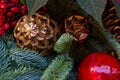 Composition of Christmas toys and cones and branches of spruce. Close-up Royalty Free Stock Photo