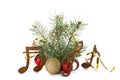 Composition with Christmas tree branch, decor and wooden music notes on white background Royalty Free Stock Photo