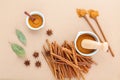 Composition of cinnamon stick and cinnamon powder in white mortar with star anise ,bay leaves and wooden spoon on brown Royalty Free Stock Photo