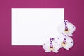 Top view of sheet of paper with orchid flowers on red background with copy space.