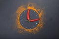 Composition of a clock from spices and chili peppers on a black background.