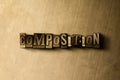 COMPOSITION - close-up of grungy vintage typeset word on metal backdrop