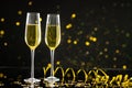 Composition of close up of new years champagne on black background