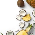 Composition with coconuts, juicy pineapples and leaves Royalty Free Stock Photo