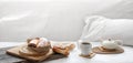 Composition with coffee and fresh buns in bed copy space Royalty Free Stock Photo