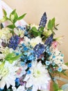 Composition with Colorful flowers. Flowers blue muskari, white chrysanthemum, alstroemeria and blue gypsophila. Flowers close up