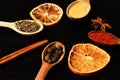 Composition of condiment, close up. Set of spices, grey background. Royalty Free Stock Photo