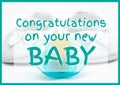 Composition of congratulations on your new baby text and booties