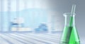 Composition of conical flask of green liquid and stirrer, with blurred background copy space Royalty Free Stock Photo