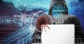 Composition of covid 19 virus cell and binary coding data processing over hacker using laptop Royalty Free Stock Photo