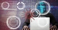 Composition of covid 19 virus cell and binary coding data processing over hacker using laptop Royalty Free Stock Photo