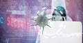 Composition of covid 19 virus cell and binary coding data processing over hacker using laptop Royalty Free Stock Photo